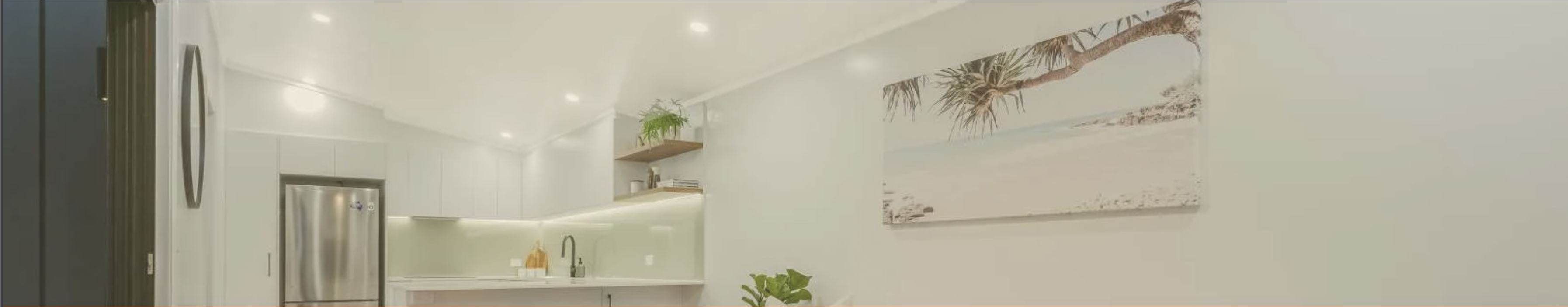 Wide Tiny Home Central interior showing kitchen and living space